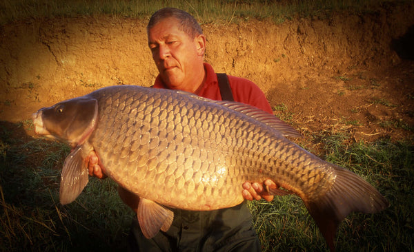 Ken with the carp he caught with the ingredients of Red Factor and a dash of Robin Red