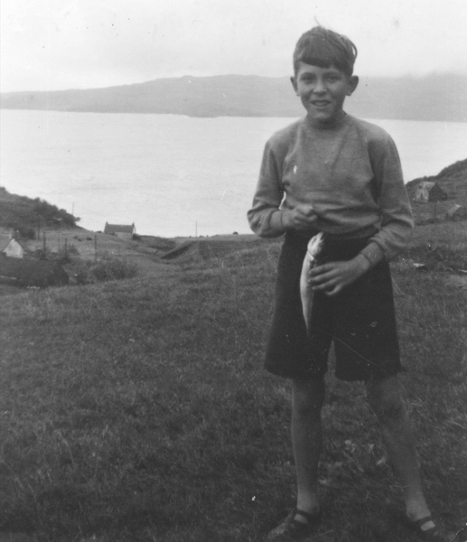 Boy holding a fish