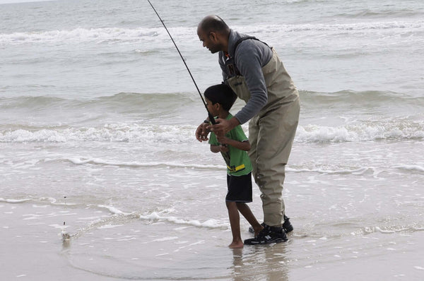 Dad and son fishing.