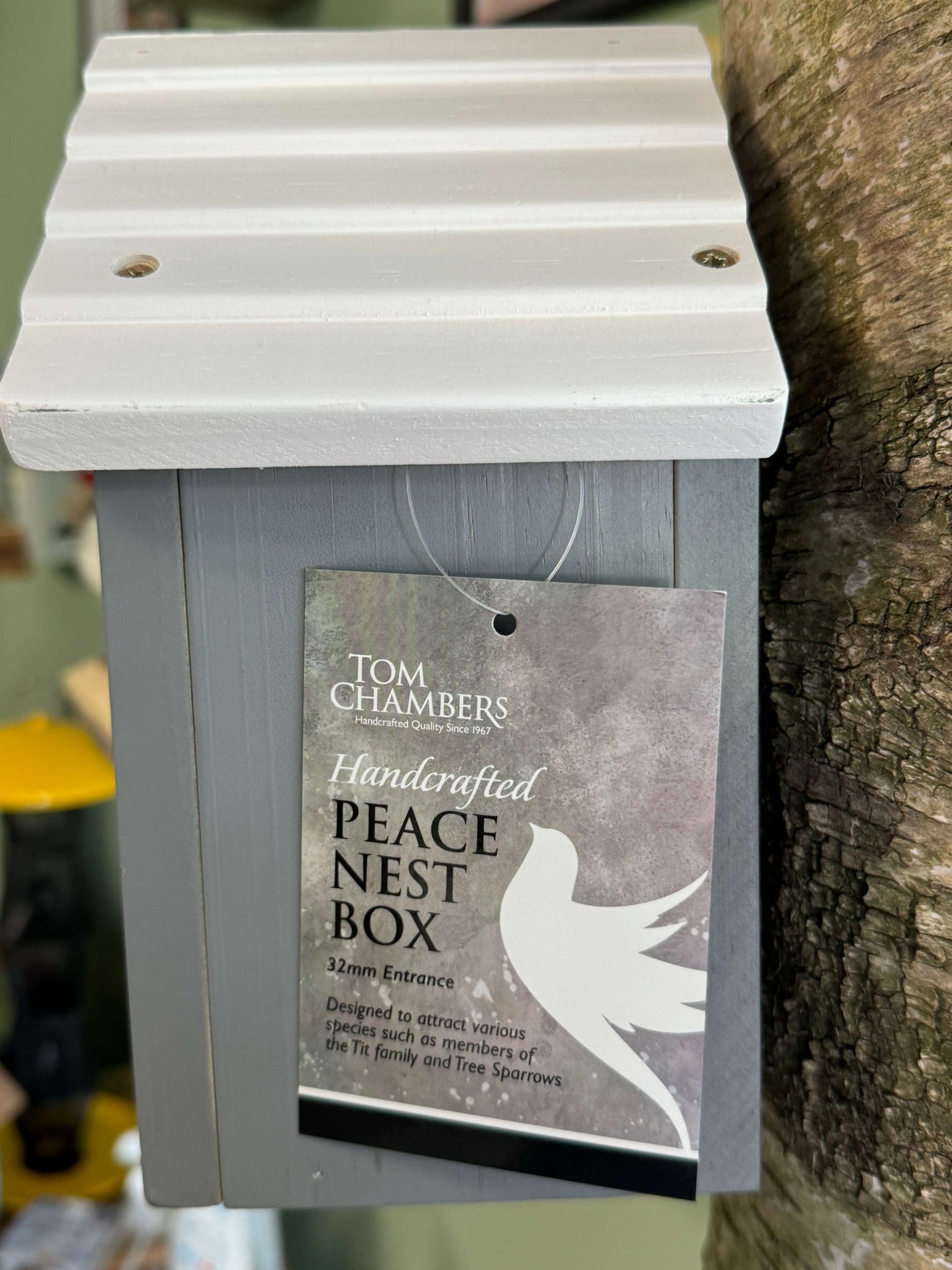 Side of nest box, showcasing the beautiful woodwork and colour contrast of this unique item.