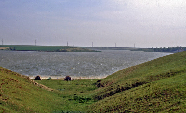 Photograph taken from top of hill looking down valley towards the sea